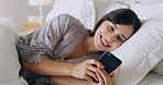 Happy, woman and texting on cellphone in bedroom for online dating app, reading social media notification and relax. Female typing on smartphone in bed, morning and mobile internet download at home