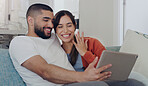 Engagement, announcement and a couple on a video call from a sofa in the living room of their home together. Smile, proud or excited with a happy man and woman sharing good news about their marriage