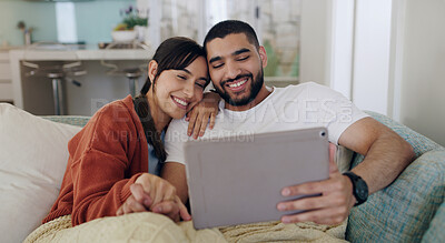 Buy stock photo Tablet, happy couple and relax on couch in home for social media, online entertainment and love. Young man, woman and digital technology for web subscription, streaming movie and network connection