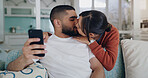 Love, kiss and couple on sofa with phone, embrace and surfing social media post or or streaming online. Cellphone, man and woman on couch, kissing and hugging in romantic relationship in living room.