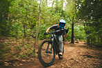 Mountain bike, man and rock on sign of freedom, adventure and speed of motion blur in forest. Bicycle athlete, extreme sports and hands of horn gesture for action, off road competition and adrenaline