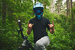 Mountain bike, nature and man with rock on sign for freedom, adventure and forest racing. Bicycle athlete, sports and hands with horn gesture for action, off road competition or emoji of race winner