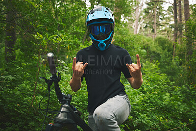 Buy stock photo Mountain bike, nature and man with rock on sign for freedom, adventure and forest racing. Bicycle athlete, sports and hands with horn gesture for action, off road competition or emoji of race winner