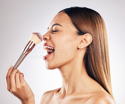 Buy stock photo Makeup, cosmetic and woman with a brush in studio with a natural, beauty and face routine. Glamour, cosmetology and female model laugh with cosmetics product for cheeks isolated by white background.