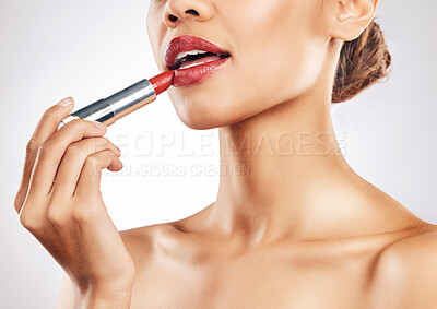 Buy stock photo Woman, lips and red lipstick with makeup and beauty, cosmetic product and glow isolated on studio background. Female model apply cosmetics, mouth and cosmetology with skin, shine and glamour