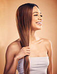 Happy woman, hair and beauty with salon hairstyle, haircare and keratin treatment isolated on studio background. Female model smile, color highlights and cosmetic care, texture and growth with shine