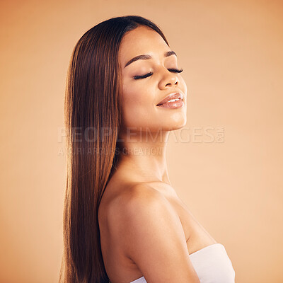 Buy stock photo Beauty, hair and face of woman for wellness, keratin treatment and cosmetics in studio. Salon, hairdresser and female person with eyes closed on orange background for growth, hairstyle and texture