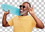 One mature african american man standing with a mini skateboard in studio isolated against isolated on a png background. Handsome and carefree man wearing sunglasses and laughing happily. Summer means rock on