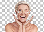 Portrait of one happy mature caucasian woman posing topless against a purple copyspace background. Ageing woman applying cream, moisturiser, sunblock during a skincare routine in a studio