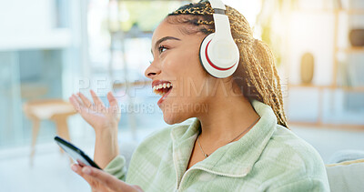 Buy stock photo Phone, singing and happy woman on music headphones in home living room. Smartphone, dance and excited African person listening to radio, audio and sound for freedom, celebration and streaming online