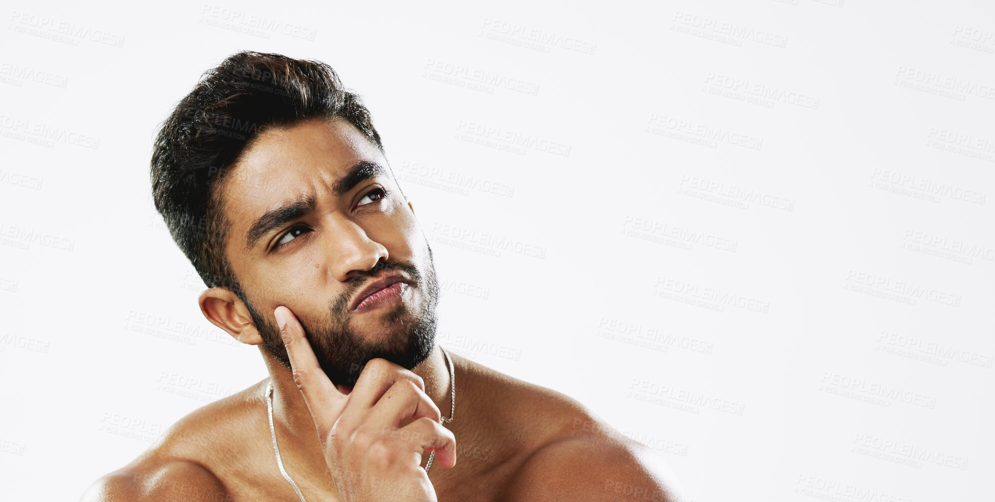 Buy stock photo Thinking, idea and confused man in studio for wellness, skincare and beauty on a white background mockup space. Doubt, decision making and Indian male model with question, solution and contemplating