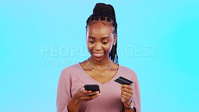 Online shopping, credit card and black woman with phone in studio for ecommerce on blue background. Debit, credit score and girl online for subscription, membership or budget, payment and banking