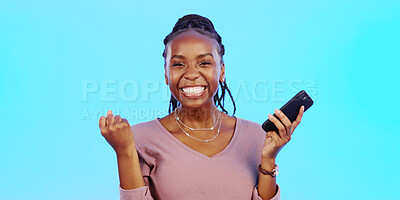 Wow, happy and excited black woman with phone receiving email news of bonus, promotion or announcement in studio. Winning, prize notification and African girl celebrating with smile on blue background