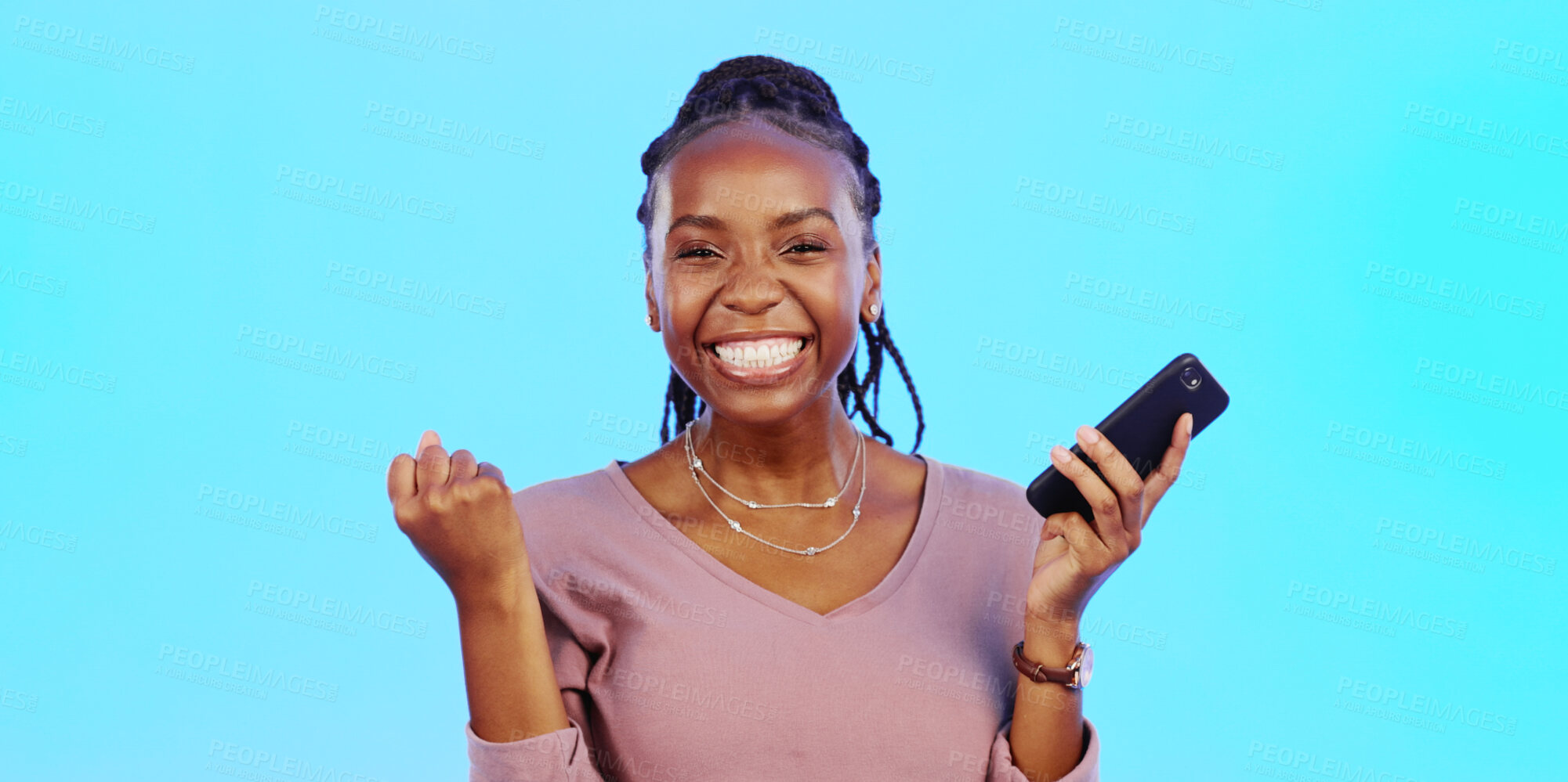 Buy stock photo Woman, winning and phone in success, celebration and yes for news, competition or achievement in studio. Excited portrait of an african winner with fist and mobile or online bonus on blue background