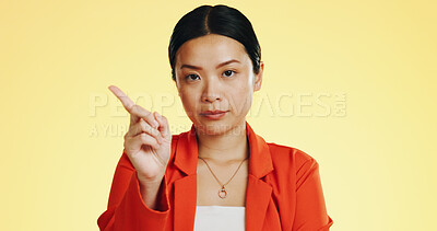 Face, warning and Asian woman serious, finger and stop against a studio background. Portrait, Japanese female and lady with hand gesture for rejection, unhappy girl and frustrated with disagreement