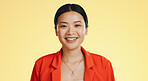 Asian woman, happy and smile on face for fashion and skincare or beauty on a yellow background. Portrait of a gen z girl model with happiness mockup space and color with a positive mindset and laugh