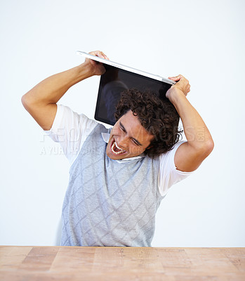 Buy stock photo Angry, laptop and frustrated businessman smash his computer due to stress isolated in a white studio background. Anxiety, depression and male employee destroy equipment due to 404, glitch or error