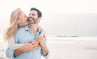 Buy stock photo Beach, love and couple hug and kiss on holiday, vacation and romantic weekend for anniversary. Mockup space, marriage and mature man embrace woman for bonding, quality time and happiness by ocean