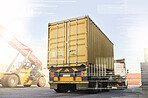 Logistics truck, shipping and transportation of cargo at a supply chain port ground. Ecommerce stock, delivery service and trade of commercial freight container at an outdoor manufacturing warehouse