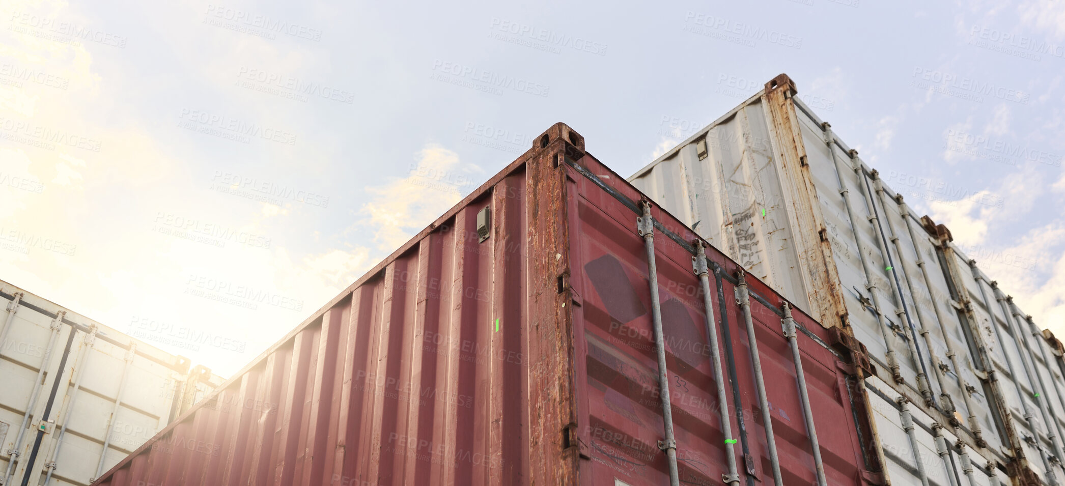 Buy stock photo Cargo container, logistics and shipping of import and export goods at storage in shipyard for global supply chain. Distribution, supply chain and industrial port against sky at international harbor