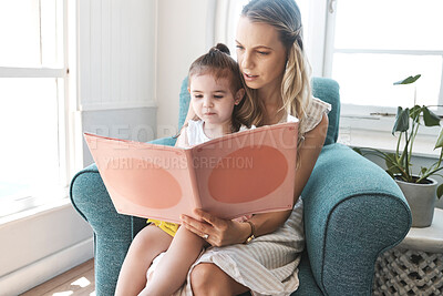 Buy stock photo Mother, girl and book on sofa for story, reading and education in home, living room and together. Mom, child and story book for learning, teaching and childhood development for smart mind in house