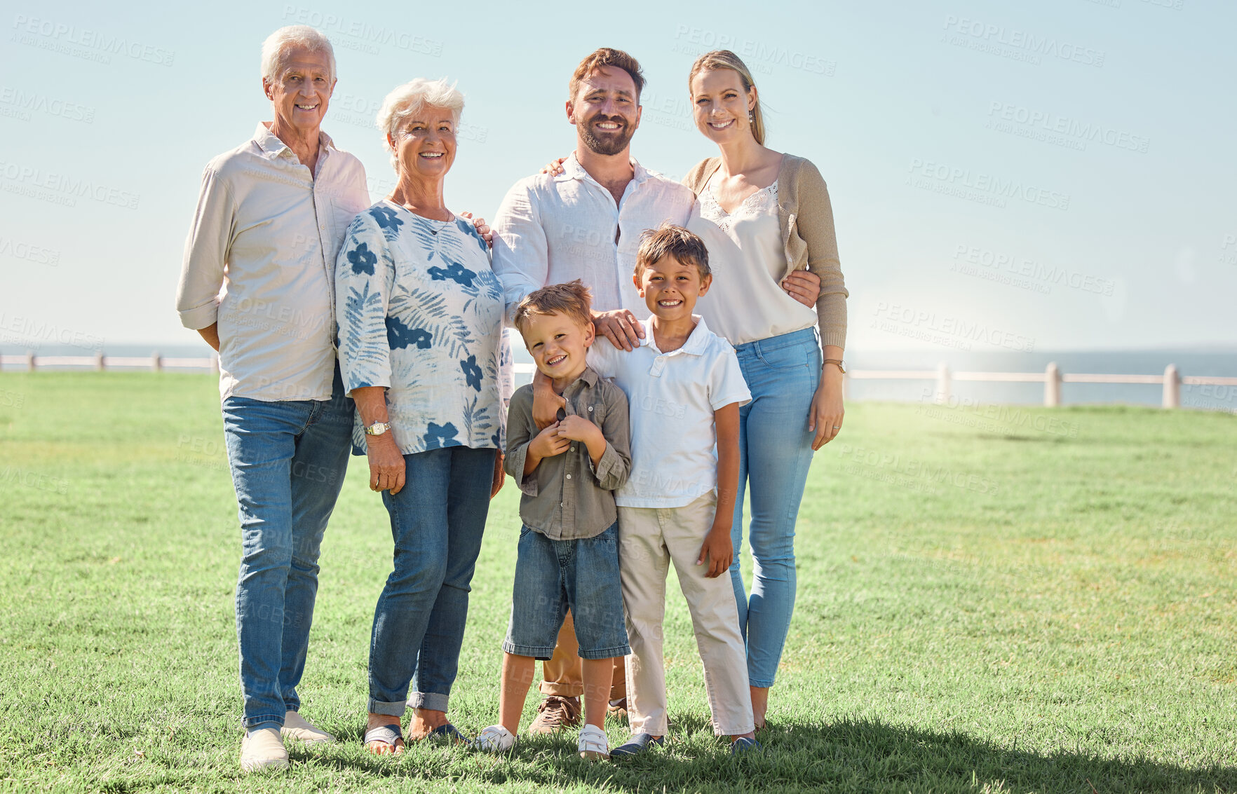 Buy stock photo Smile, field and portrait of happy family on grass lawn for outdoor fun, bonding and quality time together in Toronto Canada. Happiness, vacation and big family of grandparents, parents and children