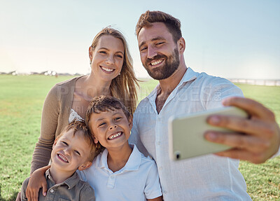 Buy stock photo Nature, selfie and phone with happy family social media picture on a holiday together in outdoor green garden. Happy, smile and parents smile, photo and love bonding with children outside in a park 