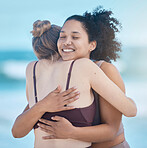Friends, women and hug after exercise outdoor, happy and calm at the beach with love and fitness together. Support, trust and friendship, workout motivation by the ocean and wellness with zen smile.