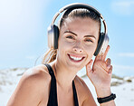 Music, fitness and woman at the beach for exercise, wellness and cardio training while listening to radio. Podcast, workout and portrait of girl relax, smile and enjoy motivation audio track for run 