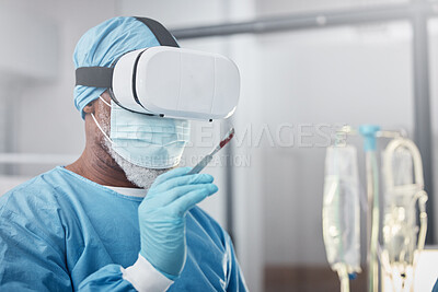 Buy stock photo Virtual reality, medical and doctor with a surgery simulation in operation room in the hospital. Vr, healthcare and male surgeon practicing and analyzing the human anatomy with futuristic device.