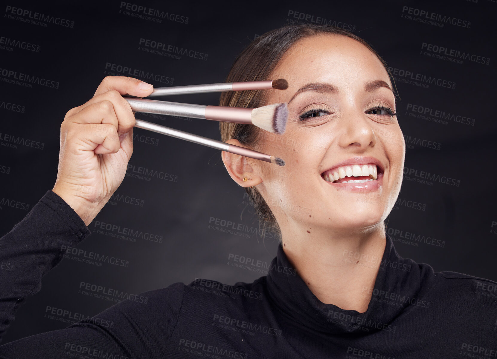 Buy stock photo Makeup, brush or portrait of woman in studio with beauty cosmetics or facial foundation products on black background. Makeup artist, smile or happy girl brushes face for luxury skincare grooming 