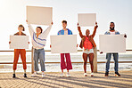 Portrait, poster and diversity with friends together holding signage in protest on the promenade by the sea. Freedom, mockup and billboard with a man and woman friend group holding blank sign boards