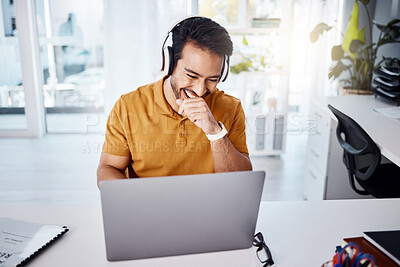 Buy stock photo Laughing, work and a businessman with headphones and a laptop for a funny video or podcast or a meme. Happy, office and an Asian businessman with comedy, streaming audio or watching on a computer