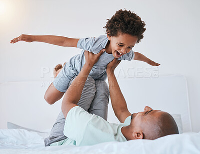 Buy stock photo Airplane, playful and father with son in bedroom for morning, wake up and weekend. Happy, excited and funny with man and young child playing in family home for happiness, freedom and support