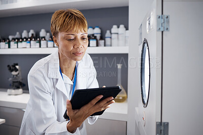 Buy stock photo Scientist, tablet and serious woman with incubator in laboratory, research or online study. Technology, medical professional and doctor of science on internet for reading, healthcare and email app.