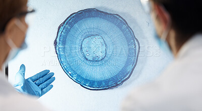Buy stock photo Bacteria, particles and closeup in lab for science with teamwork, discussion or analysis for healthcare. Scientist people, virus molecule or study for medical research, innovation and microscope view