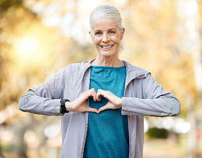 Buy stock photo Portrait, fitness and senior woman in heart sign for self care, cardiology and workout health or support outdoor. Elderly runner, sports person or athlete for love emoji, training or wellness at park