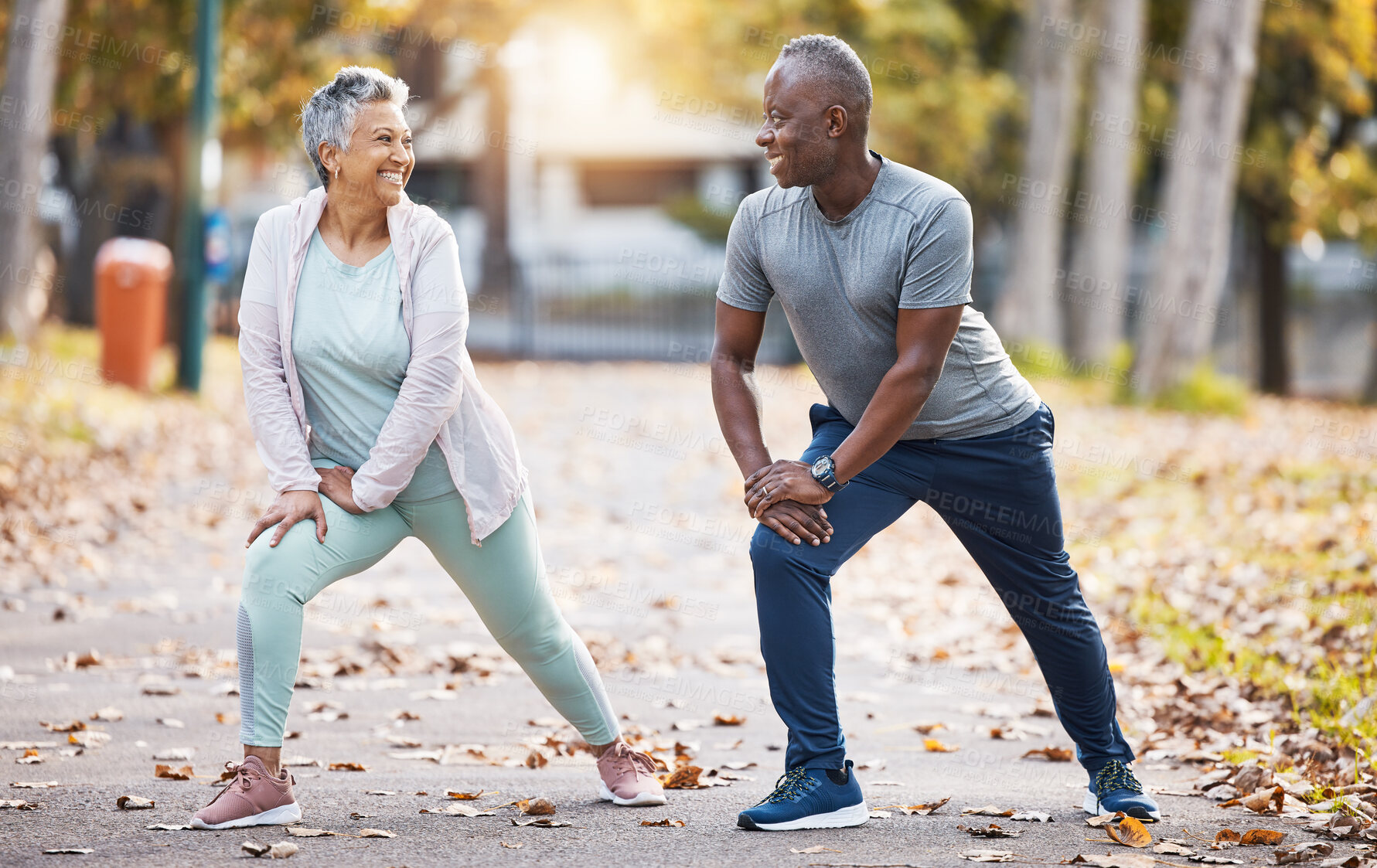 Buy stock photo Exercise, stretching and senior couple in park for healthy body, wellness and workout outdoors. Retirement, sports and happy man and woman stretch legs for fitness, training and warm up for wellbeing