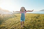 Happy, flying and portrait of girl in park with big smile excited for playing, freedom and adventure. Childhood, happiness and young child running on grass for playing, relaxing and fun in nature