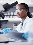 Computer, black woman or scientist reading research for online analysis, sustainability or innovation. Science, studying biotechnology or African ecology expert in a laboratory for agro development 