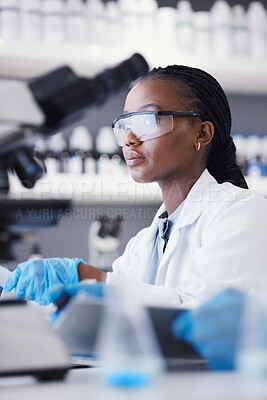 Buy stock photo African scientist woman, laboratory and microscope analysis with thinking, pharmaceutical company or virus. Lady, medical research and brainstorming with data, info and pharma study for healthcare