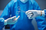 Surgery, nurse hands doctor scissors with medicine and surgical procedure, closeup and healthcare in hospital. Health insurance, medical tools and help with surgeon people in operating room at clinic