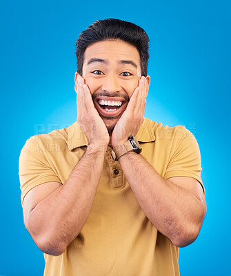 Buy stock photo Happy, excited man and surprise portrait in studio with Asian model with teeth and joy. Blue background, male person and casual fashion with handsome and friendly guy with modern style and wow face