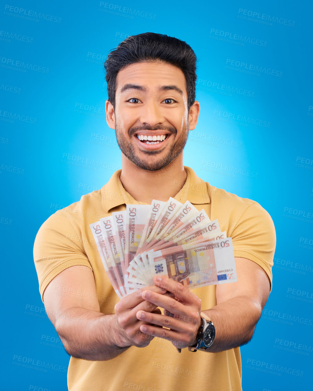 Buy stock photo Money, portrait and young man or winner with bonus, financial success and winning, cashback prize or lottery. Happy Asian person with savings, cash and investment isolated on studio blue background
