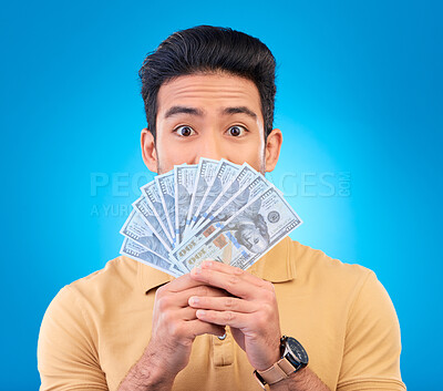 Buy stock photo Money, shocked face and man with financial surprise, winning or savings mistake isolated on blue, studio background. Lottery, finance secret and asian person gambling, bonus and cashback in portrait