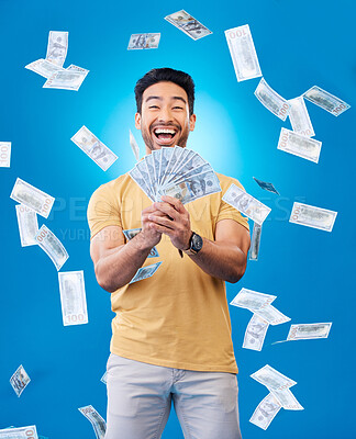 Buy stock photo Happy, portrait of a man with money fan and in a blue background for investment. Rich or cash, stock market or budget and male person with financial freedom against a studio backdrop for winner prize