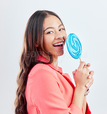 Buy stock photo Portrait, lollipop and woman with sweets, funny and happiness against a white studio background. Face, female person or happy model with candy, dessert and laughing with a smile, humor and creativity