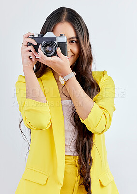 Buy stock photo Smile, portrait and a woman with a camera for a photo, memory or career in photography. Happy, paparazzi and a young girl or photographer taking a picture isolated on a white background in studio