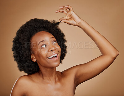 Buy stock photo Happy black woman, hair care and natural afro for beauty in studio isolated on a brown background. Growth, hairstyle or excited African model with cosmetics after salon treatment for healthy wellness