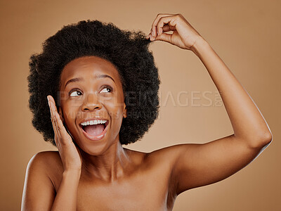 Buy stock photo Excited black woman, hair care and afro for beauty in studio isolated on a brown background. Growth, hairstyle or happy African model with natural cosmetics after salon treatment for healthy wellness